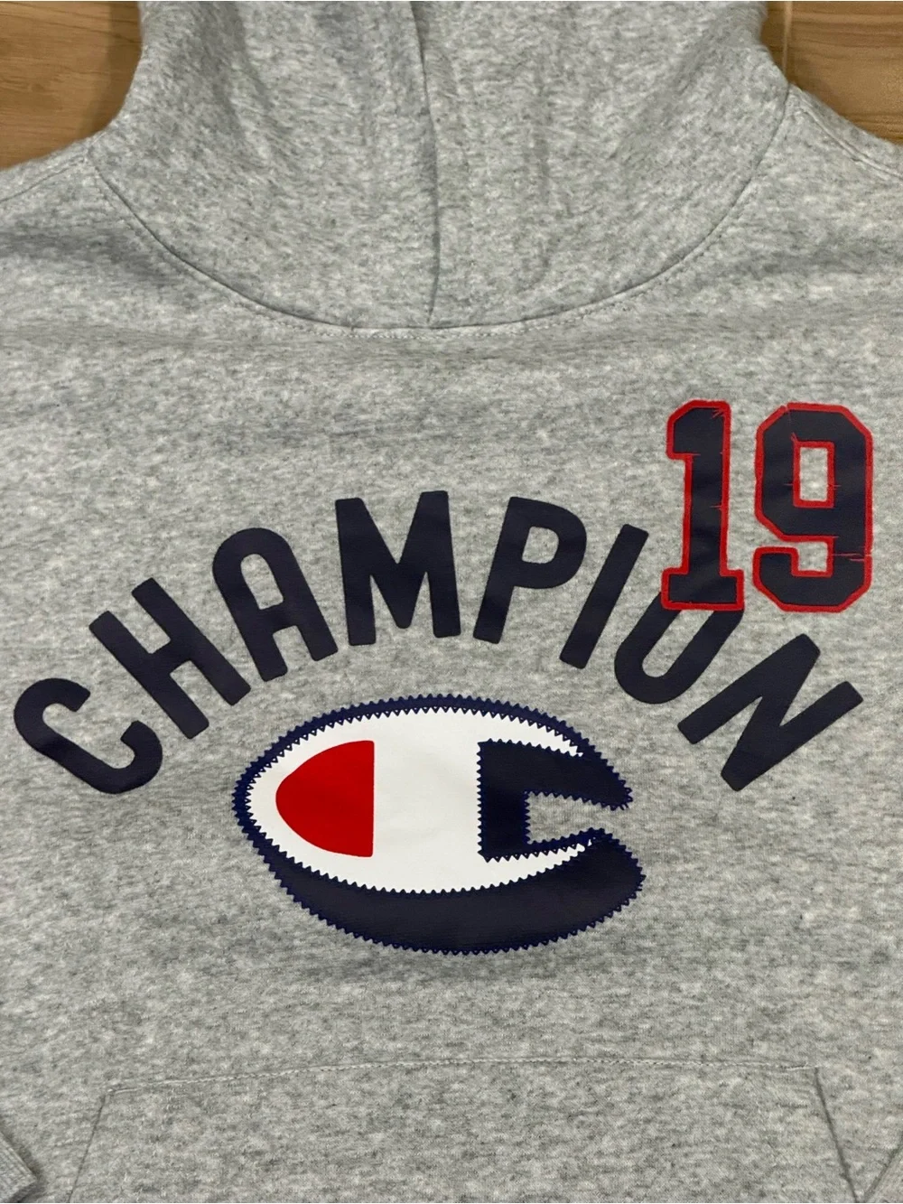 Champion Heather Gray Kids Hoodie with Navy Logo and Red '19 Patch